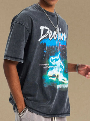 GraphiSleeve acid-washed black crew neck t-shirt with graphic print.