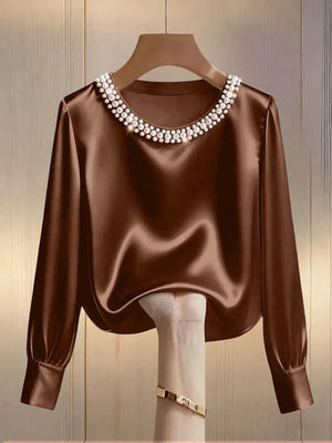 Brown satin blouse with pearl trim round neckline and long sleeves