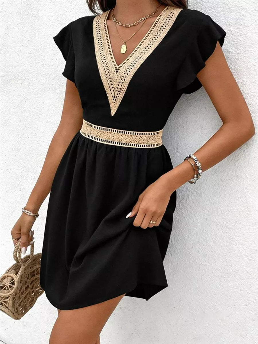 Black mini dress with V-neck lace trim and defined waist, short flutter sleeves.