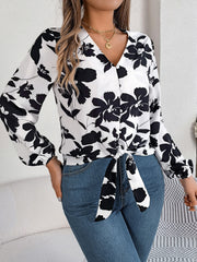 White floral knot-front blouse with ruffled cuffs and V-neck