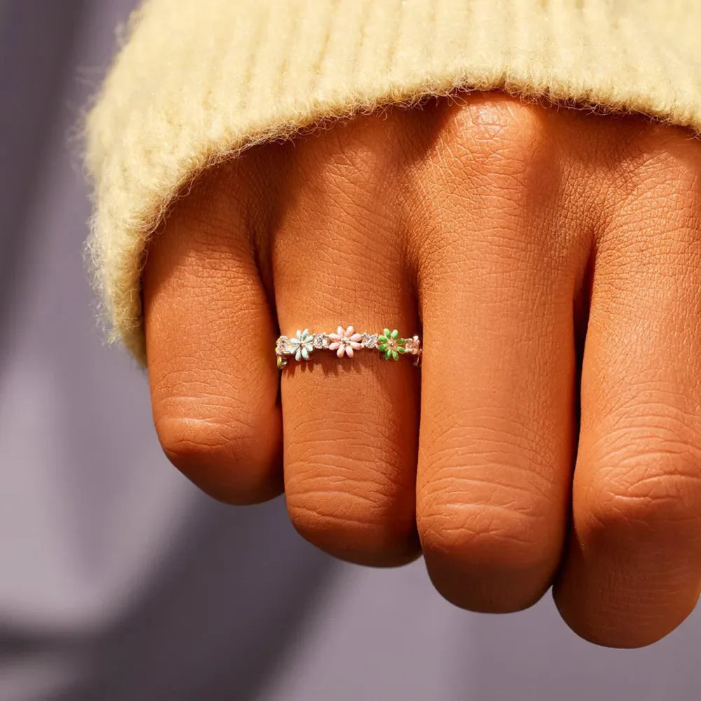 Silver enamel floral cluster ring with pastel flowers and clear stones