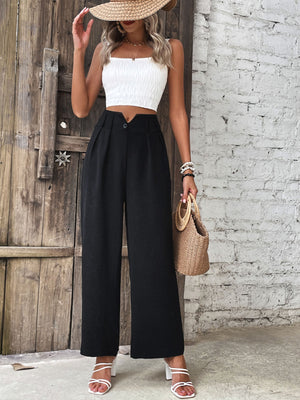 Textured black wide-leg tailored trousers with a button detail and a high waist.