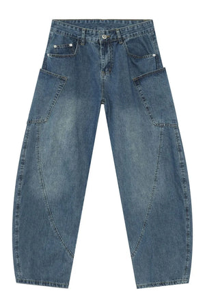 Medium wash denim balloon trousers with unique paneling and a relaxed fit.