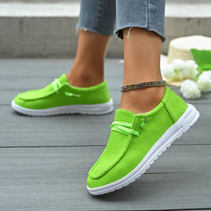 Lime green linen-blend boat shoes with contrast white sole and tie detail