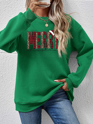 Green graphic sweatshirt with "Merry Christmas" in buffalo plaid and leopard print.