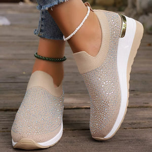 Black sneakers featuring rhinestone embellishment and rhinestone-embellished