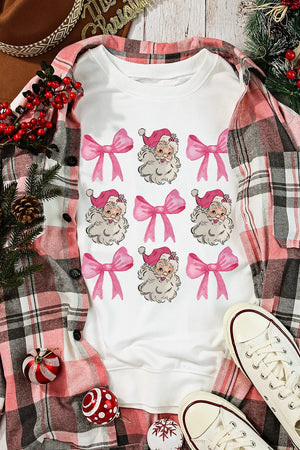 White crewneck sweatshirt with a repeating pattern of Santa faces and pink bows.