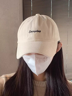 Beige cotton baseball cap with black "Everyday" embroidery