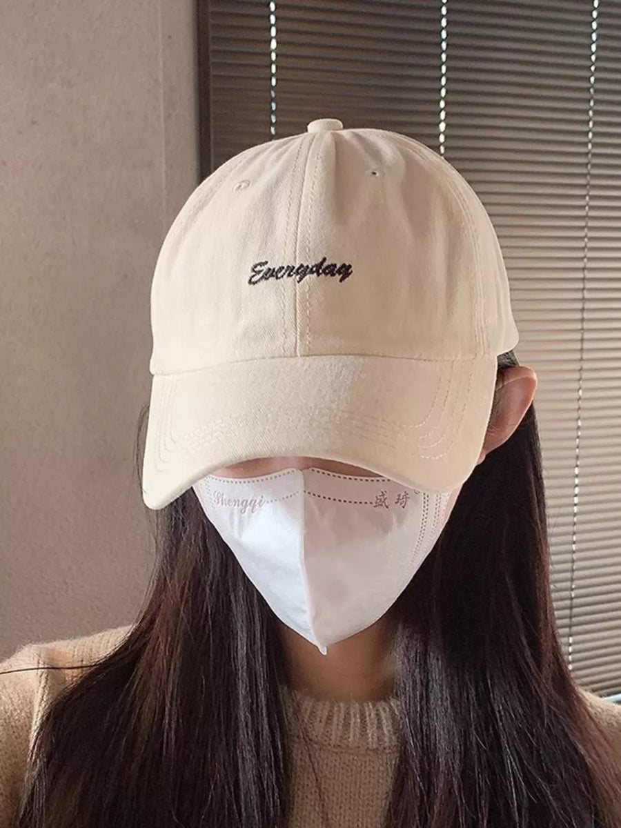 Beige cotton baseball cap with black "Everyday" embroidery