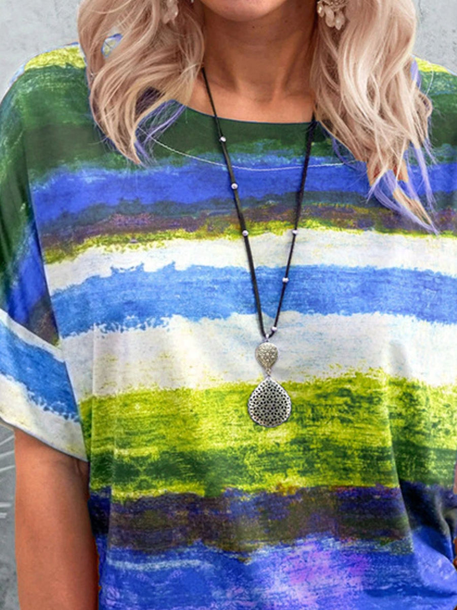 Casual t-shirt with brushstroke stripes in green, blue, and purple.