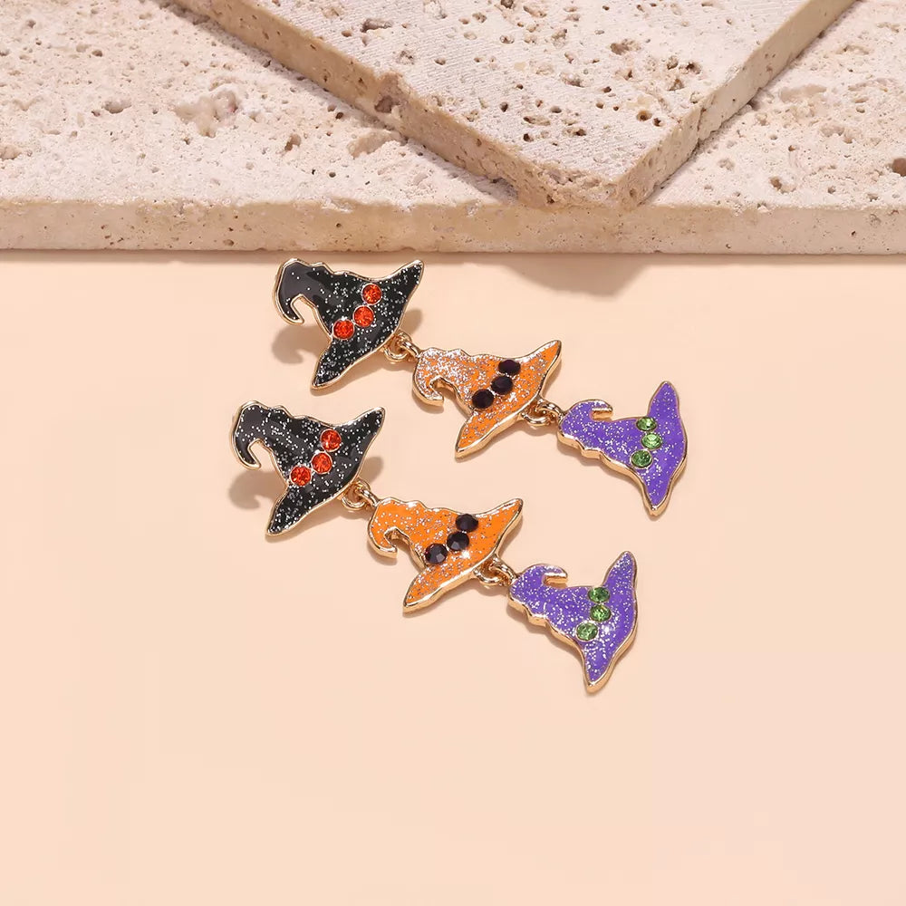 orange earrings featuring drop earrings and graphic