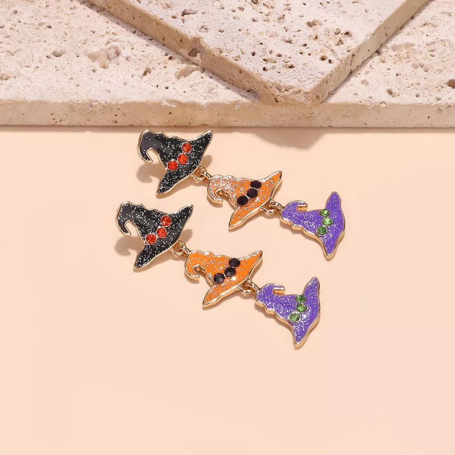 orange earrings featuring drop earrings and graphic