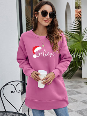 Christmas graphic tunic sweatshirt in Dusty Pink with "Believe" and Santa hat graphic, crewneck, long sleeves.