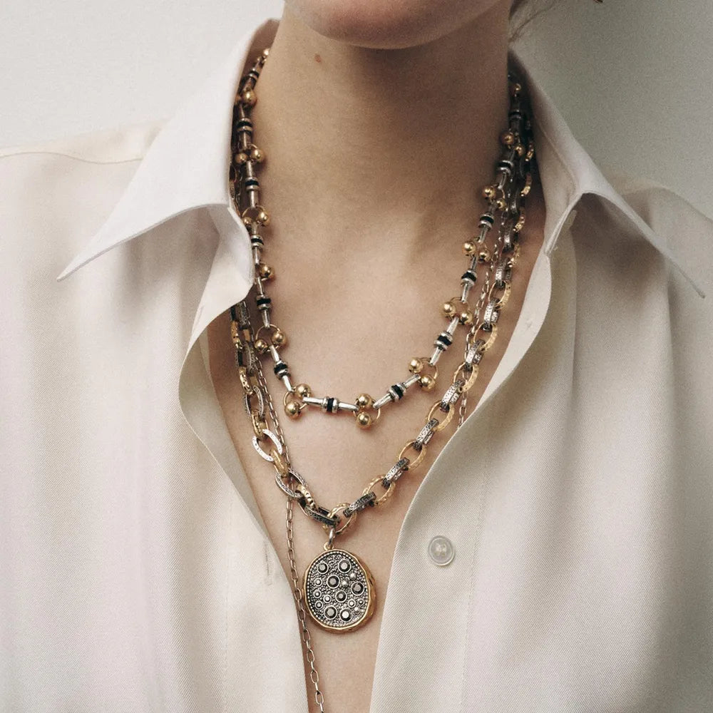 necklace in gold featuring layered and loose fit