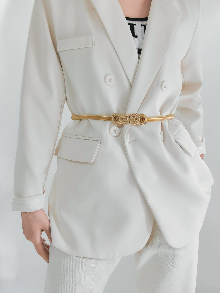 Gold intertwined knot metal waist belt with a textured buckle detail.