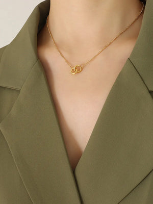 Gold interlocked circle pendant necklace with a delicate chain.