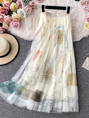 Off-white tulle skirt with abstract sunburst print and pleated hem.