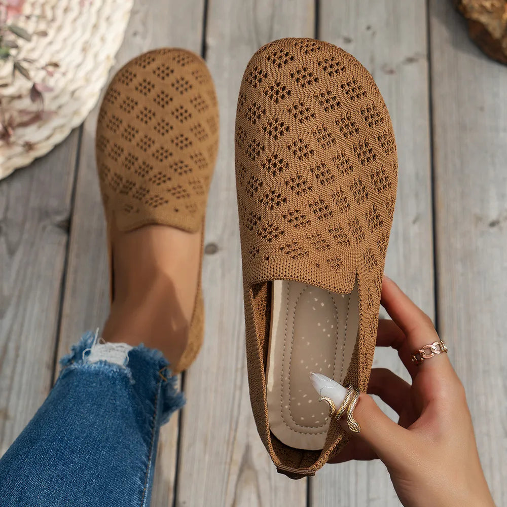 Tan diamond knit loafers flats with a breathable perforated pattern.