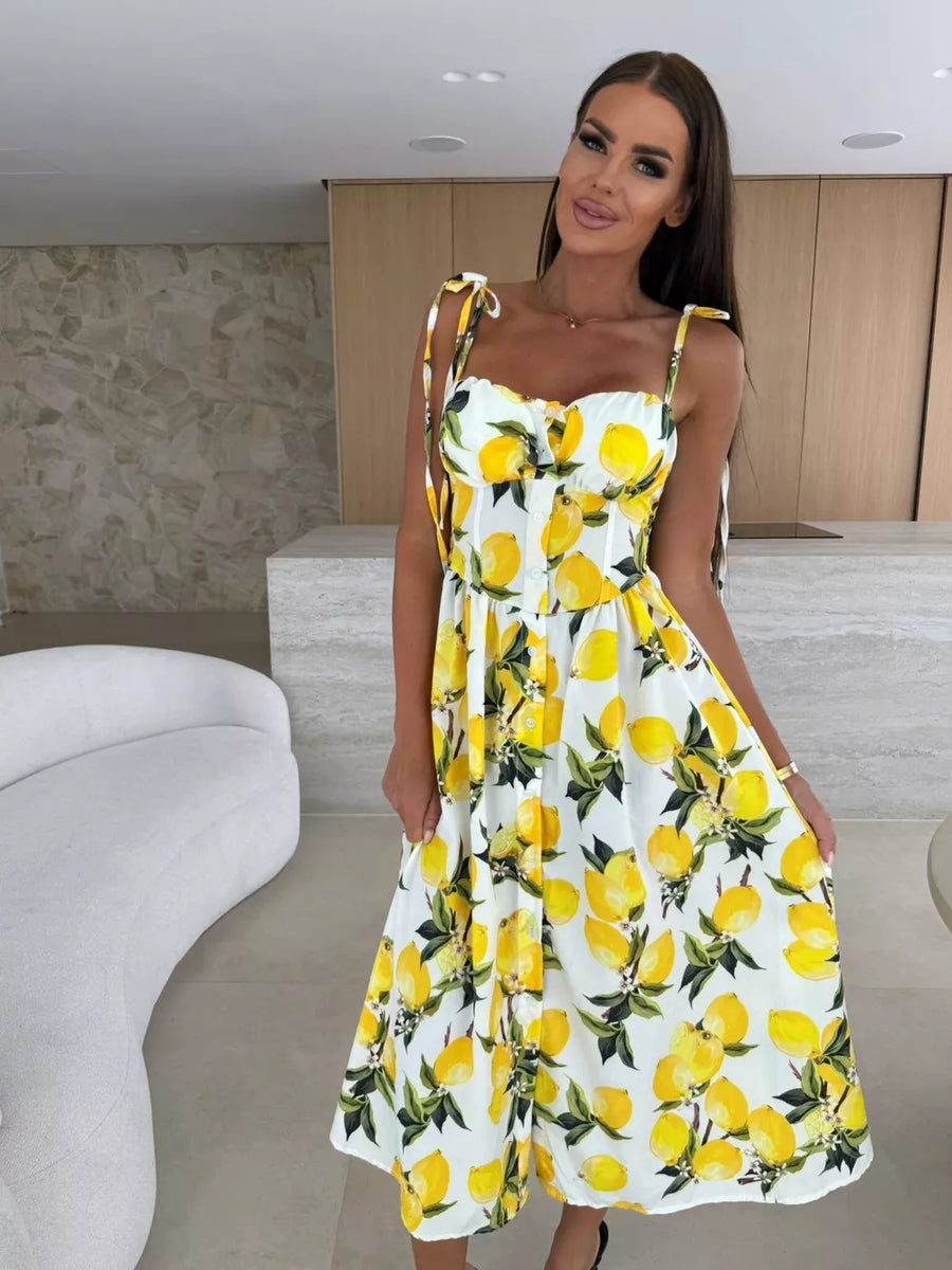 Floral tie-strap midi dress with a lemon print and button front.