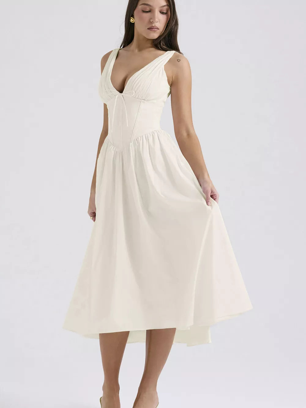 Cream V-neck midi dress with ruched bodice and a-line skirt