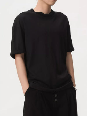 Black cotton t-shirt with rolled sleeves and round neck.