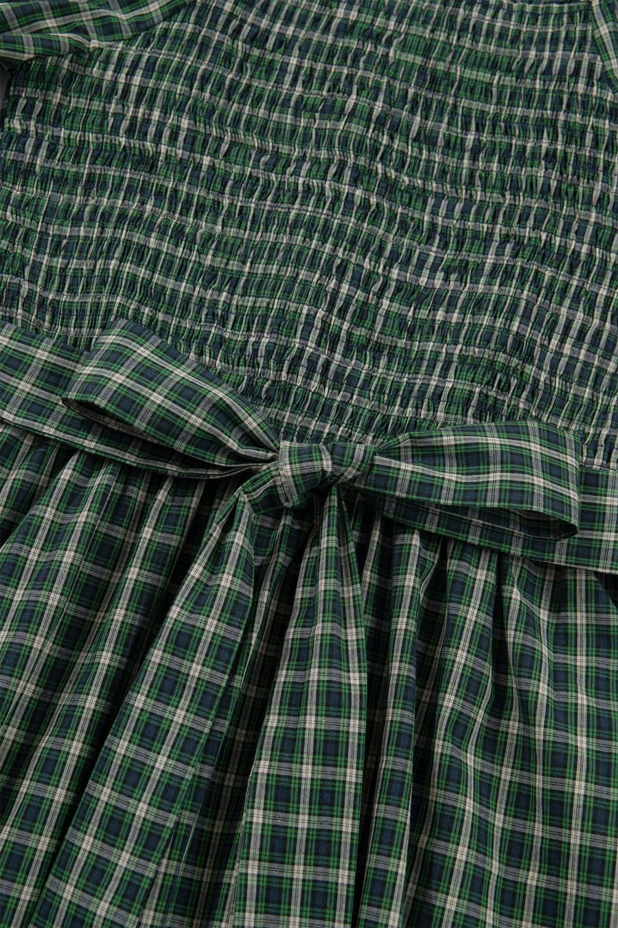 Green plaid maxi dress with smocked bodice and bow detail