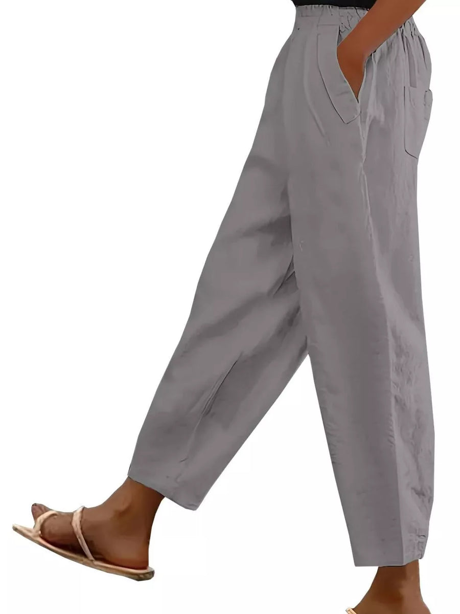 Gray wide-leg maternity pants with pockets and a relaxed fit.