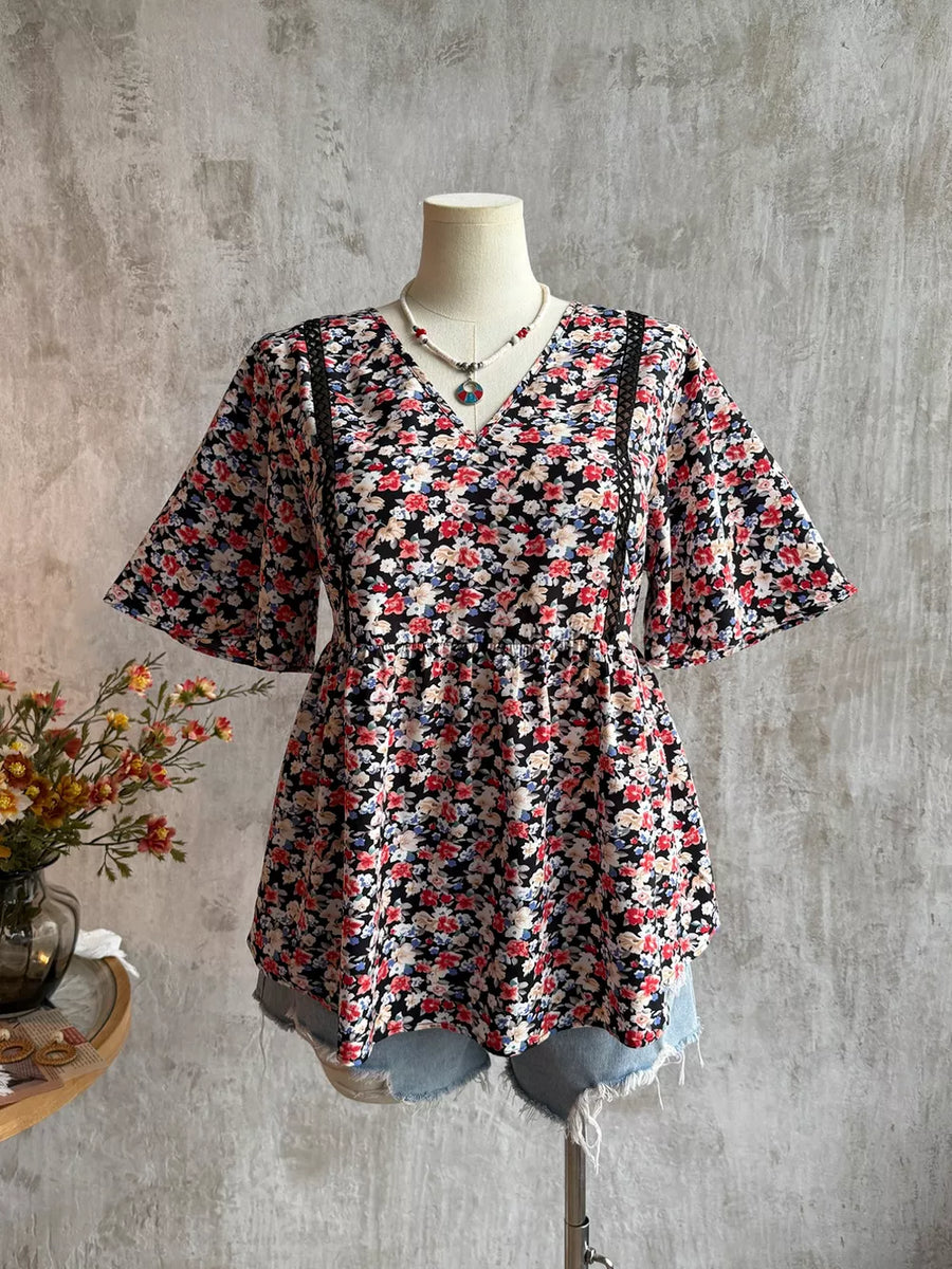 Black floral v-neck blouse with lace detail and flutter sleeves