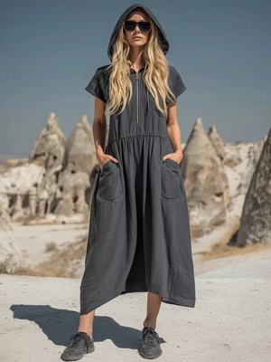 Grey hooded midi dress with short sleeves, zip neckline, elastic waist, and functional pockets.