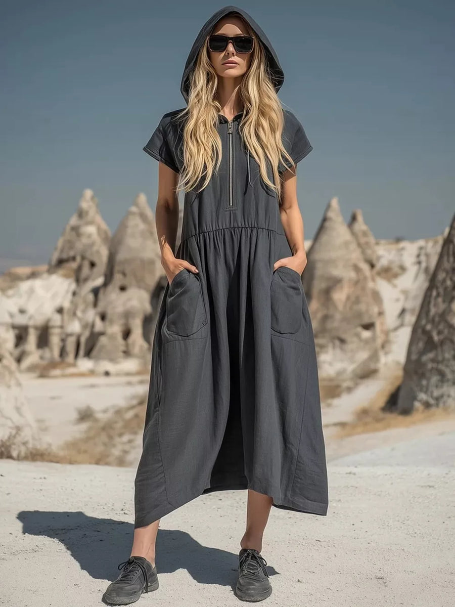 Grey hooded midi dress with short sleeves, zip neckline, elastic waist, and functional pockets.