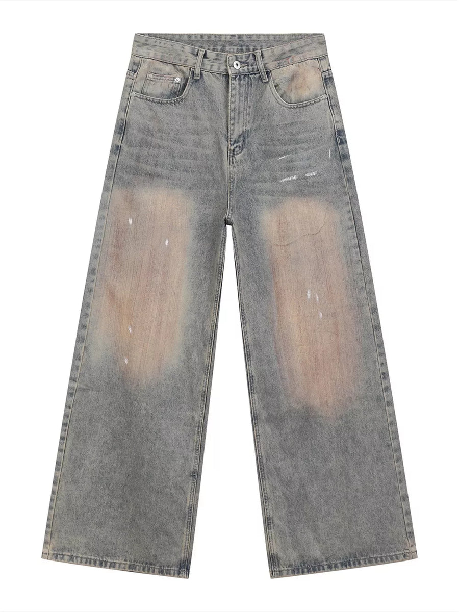 Relaxed fit blue 100% cotton jeans with distressed vintage wash and baggy legs.