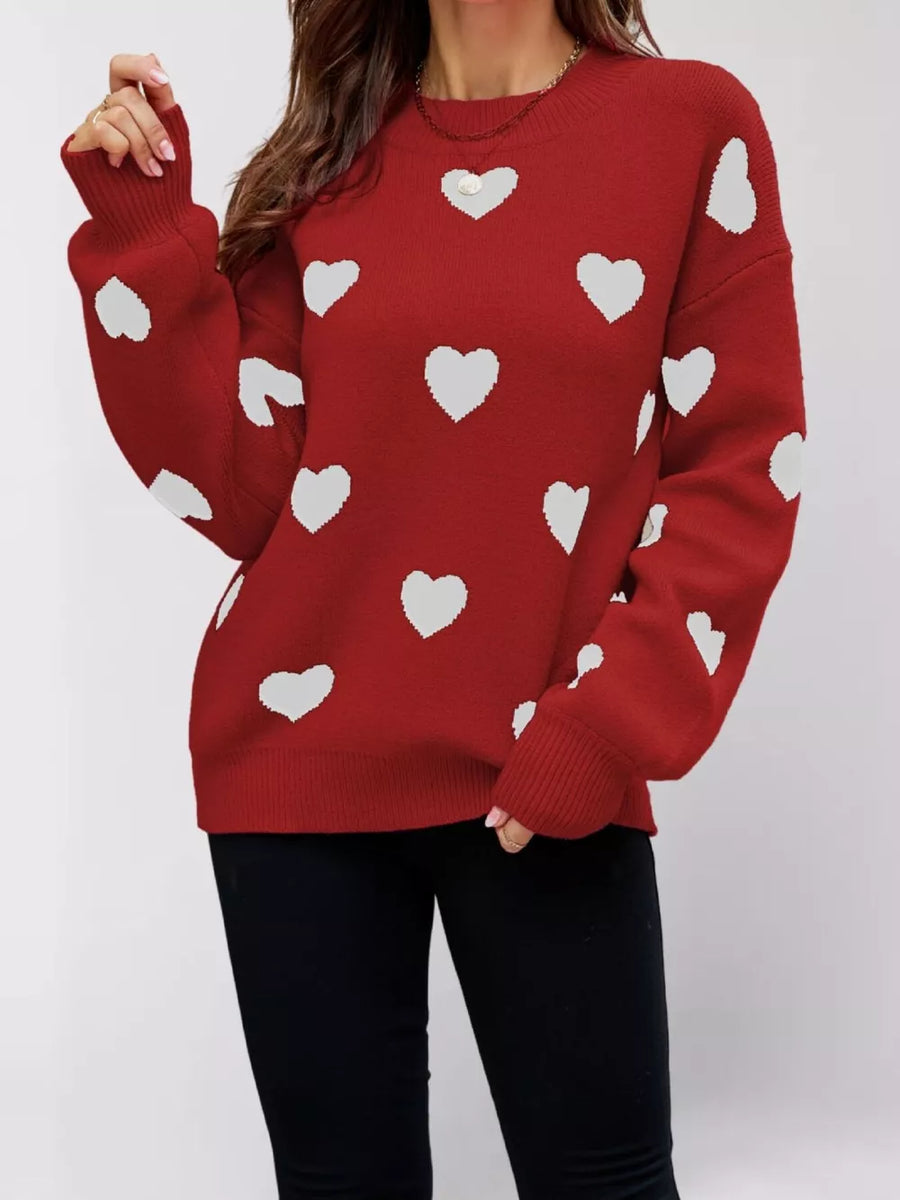pullover sweater featuring heart-print in Black with 100% polyester Care instructions: Machine wash cold texture