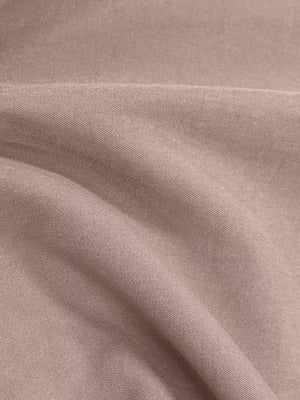 Lightweight open front cardigan in dusty pink, showing fabric texture and drape.