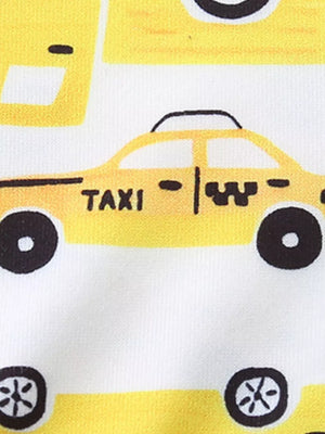 Toddler pajama set with yellow cartoon taxi print on white fabric.