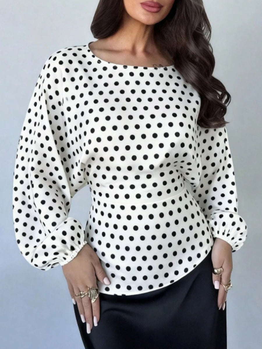 black blouse featuring back tie detail and polka dot