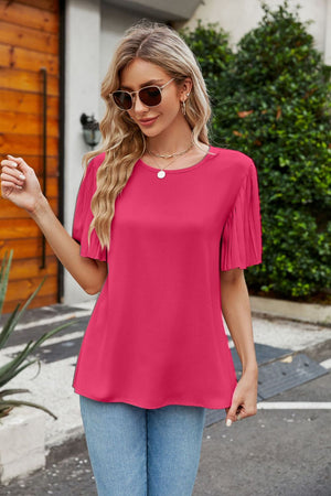 Flounce pleat blouse in Deep Rose with short sleeves and a round neckline.