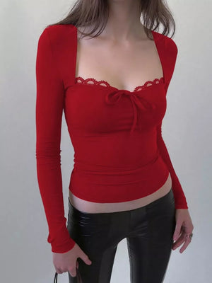 Red fitted long sleeve tee with lace trim and bow detail