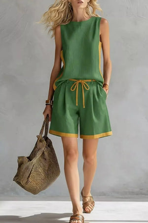Green tank and shorts set with contrast trim and drawstring waist.