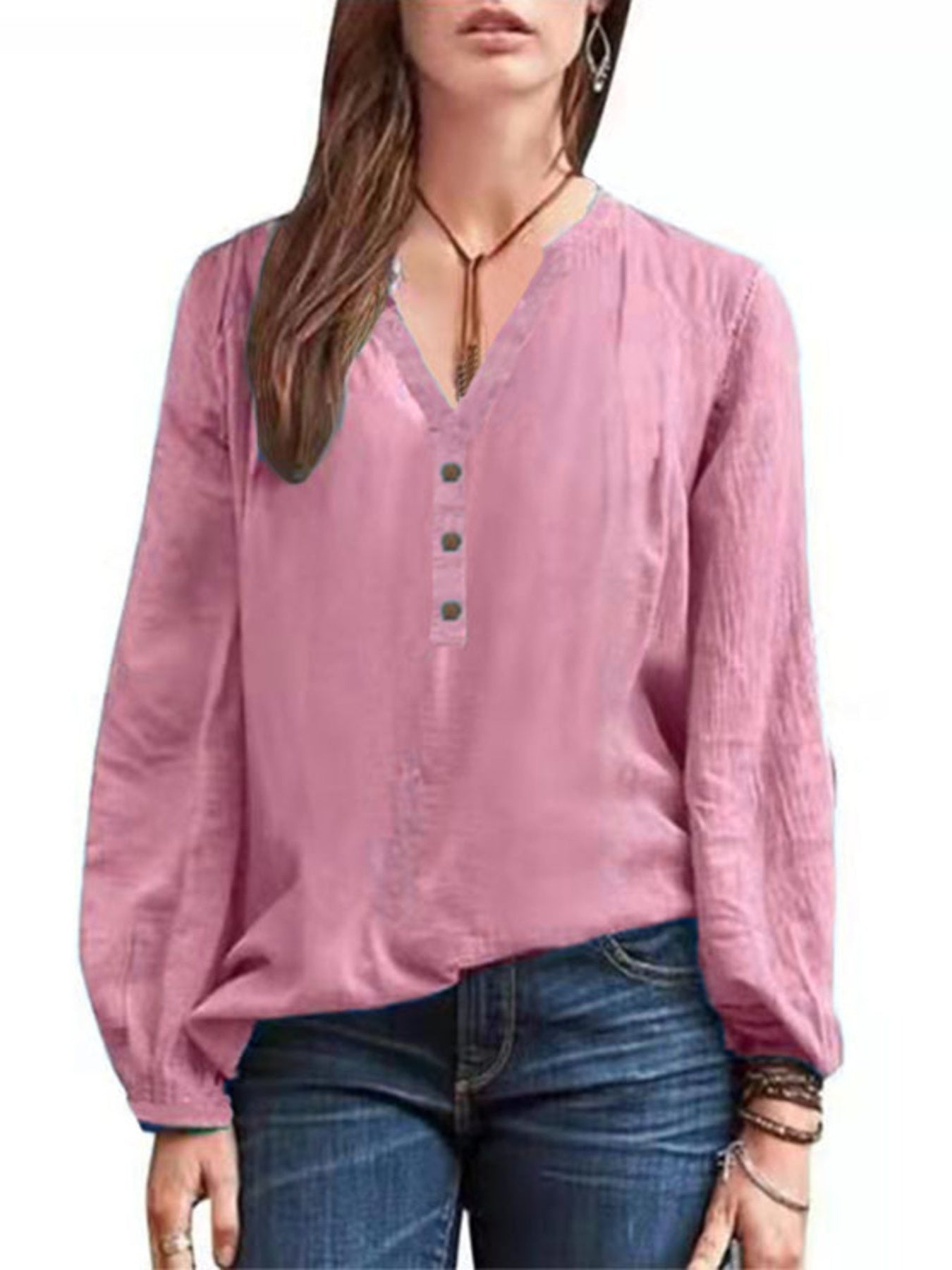 Pink long-sleeve blouse with notched neckline and button detail.