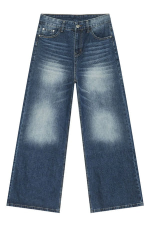 Faded wash balloon leg jeans in medium blue denim with a relaxed fit.