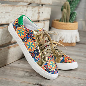 Mandala print round toe sneakers with gold accents and green heel tab.