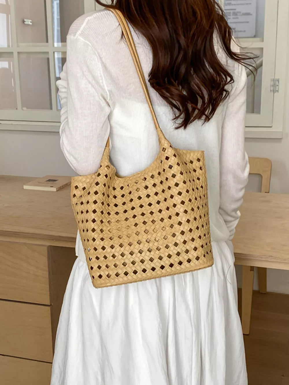black shoulder bag with open-top and woven