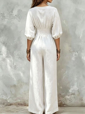 V-Neck Smocked Waist Wide-Leg Jumpsuit in Navy Blue