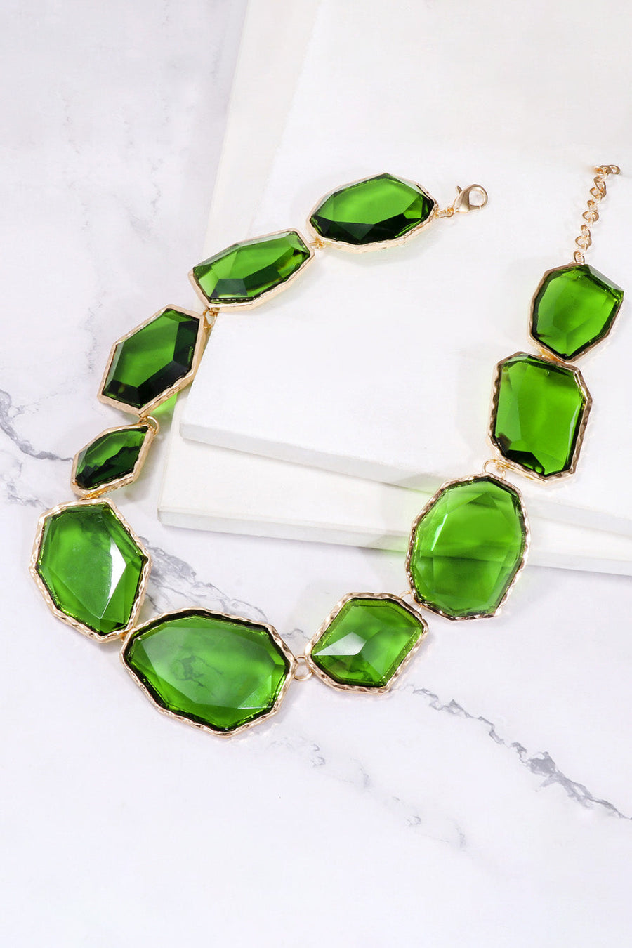 Green resin stone collar necklace with gold alloy setting and clasp.