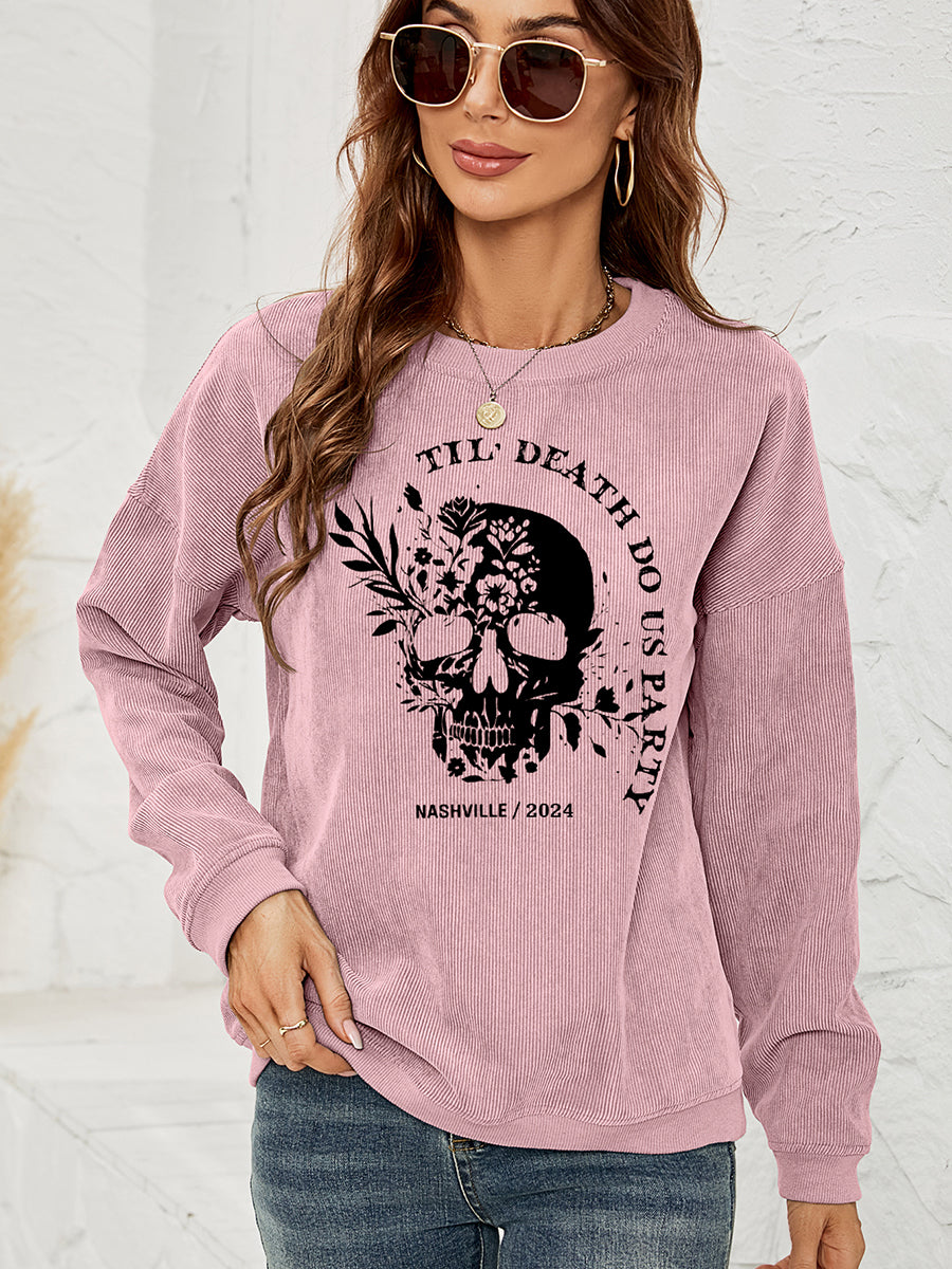 Dusty Pink corduroy sweatshirt with a black floral skull graphic and text.