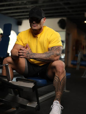 Oversized textured crew neck tee in gold with a relaxed fit and short sleeves.