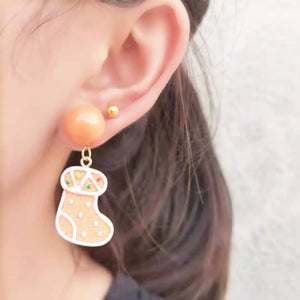 Gingerbread man holiday stocking earrings with orange stud and gold ball accent.