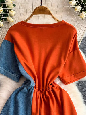 Orange and denim color block casual dress with drawstring waist.