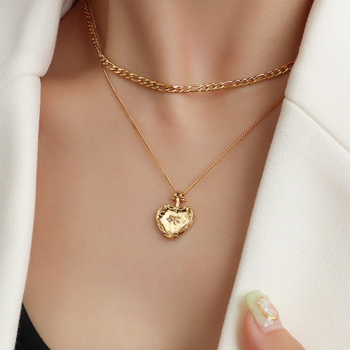 Gold layered necklace with heart locket pendant