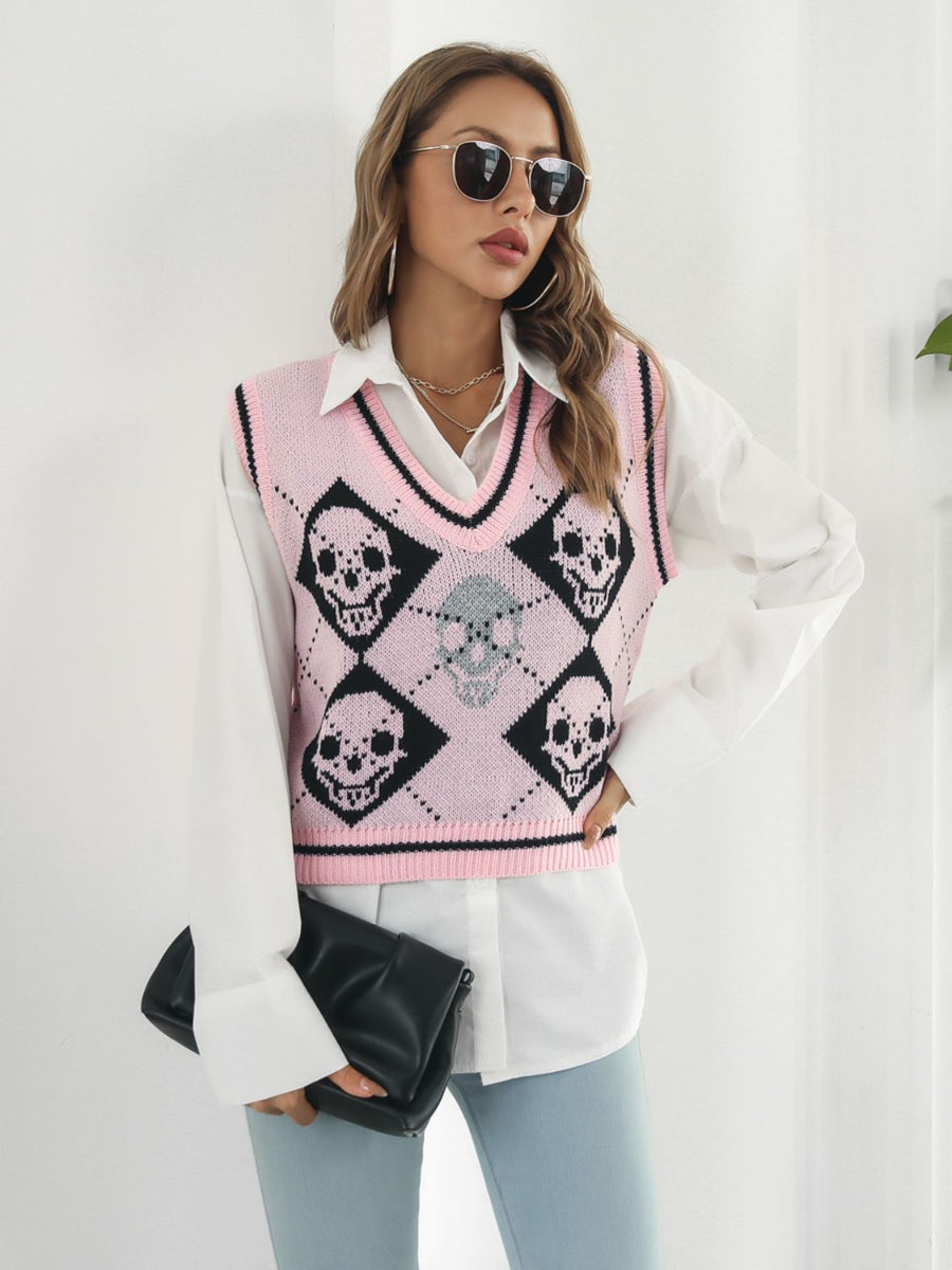 Blush pink argyle knit vest with skull motif and V-neck.